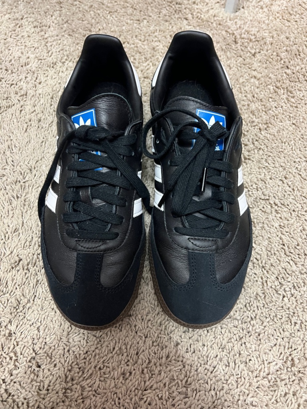 adidas women’s Black Sneakers with White Stripes and Blue Logo